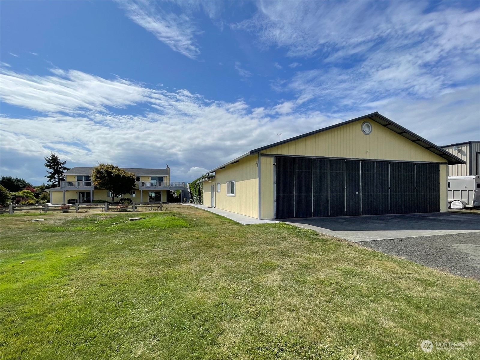 190 Greywolf Road Sequim, WA 98382 - Photo 34 of 40 a house with huge green field in front of it