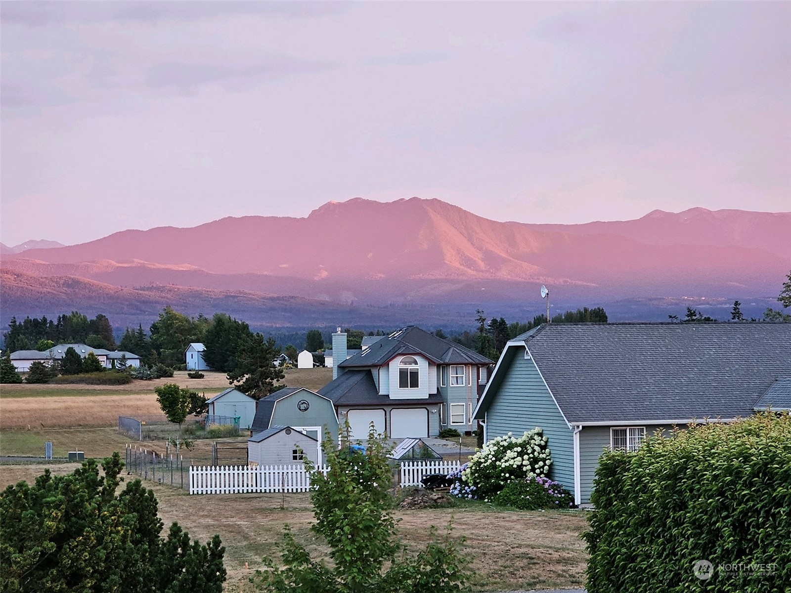 190 Greywolf Road Sequim, WA 98382 - Photo 7 of 40 an aerial view of residential houses with a street view and mountain view