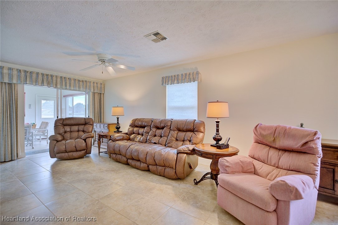 1815 Key Lake Drive Sebring, FL 33875 - Photo 12 of 41 a living room with furniture and a couch