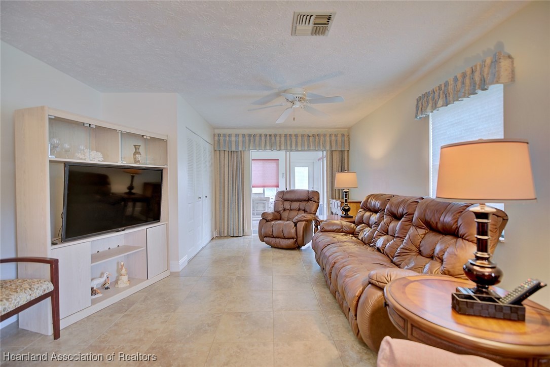 1815 Key Lake Drive Sebring, FL 33875 - Photo 13 of 41 a living room with furniture and a flat screen tv