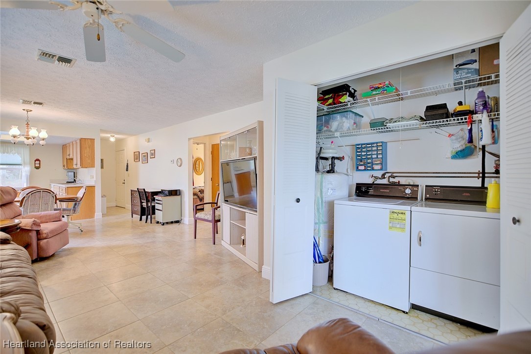 1815 Key Lake Drive Sebring, FL 33875 - Photo 16 of 41 a living room with furniture and a refrigerator