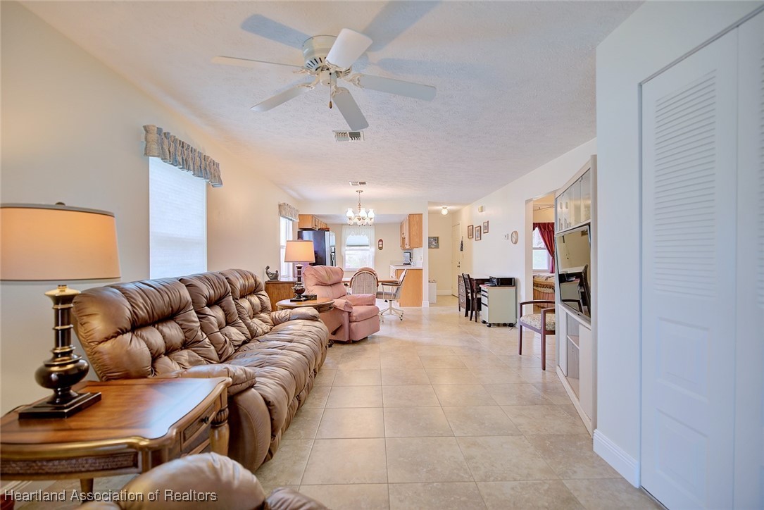 1815 Key Lake Drive Sebring, FL 33875 - Photo 17 of 41 a living room with furniture and a flat screen tv