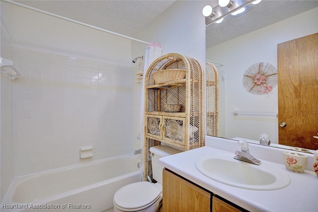 1815 Key Lake Drive Sebring, FL 33875 - Photo 21 of 41 a bathroom with a sink toilet and shower