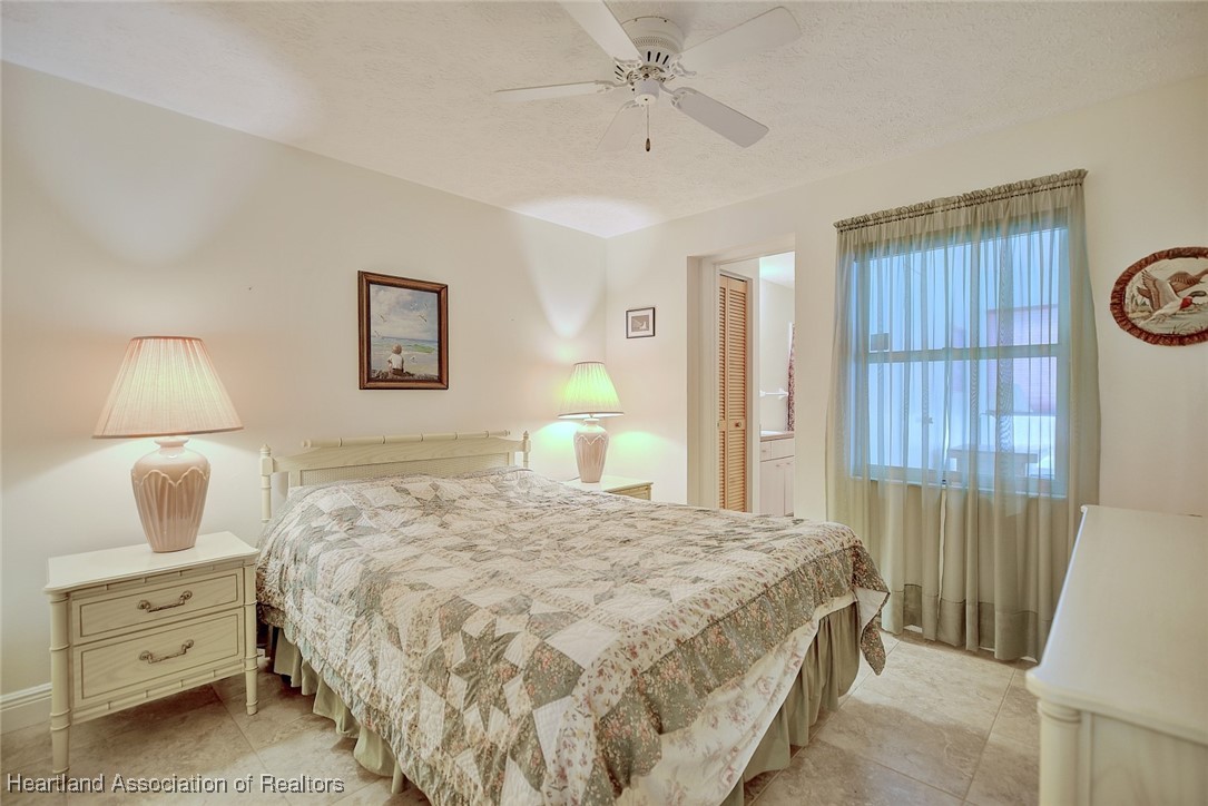 1815 Key Lake Drive Sebring, FL 33875 - Photo 22 of 41 a bedroom with a bed and a window
