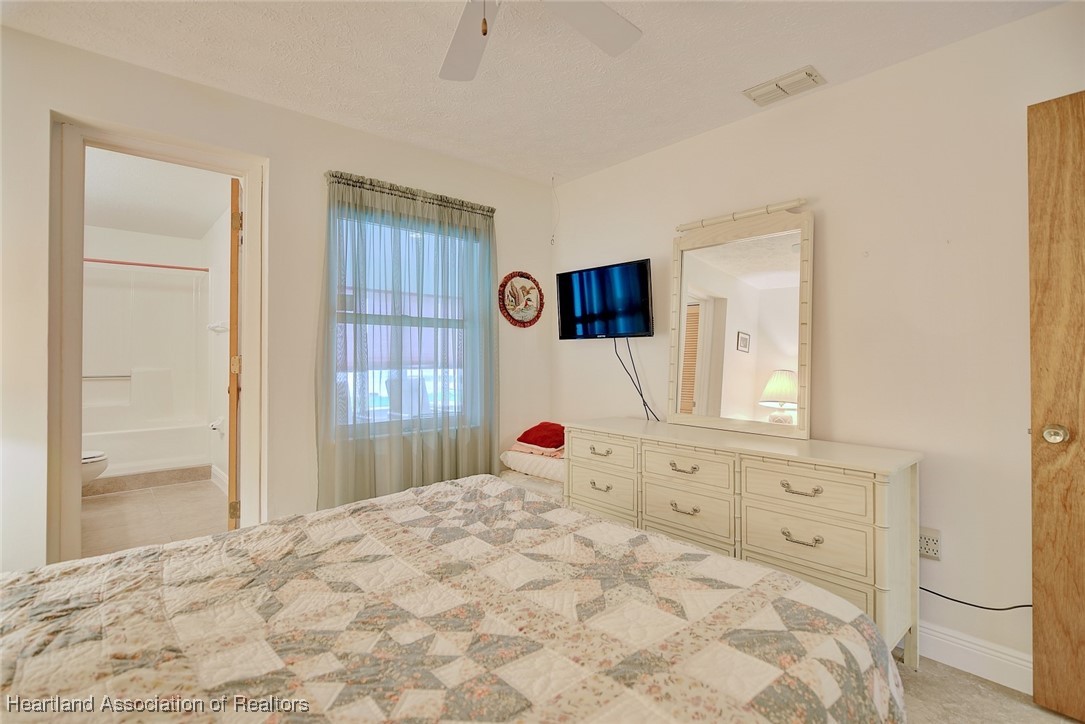 1815 Key Lake Drive Sebring, FL 33875 - Photo 23 of 41 a bedroom with a bed and a window
