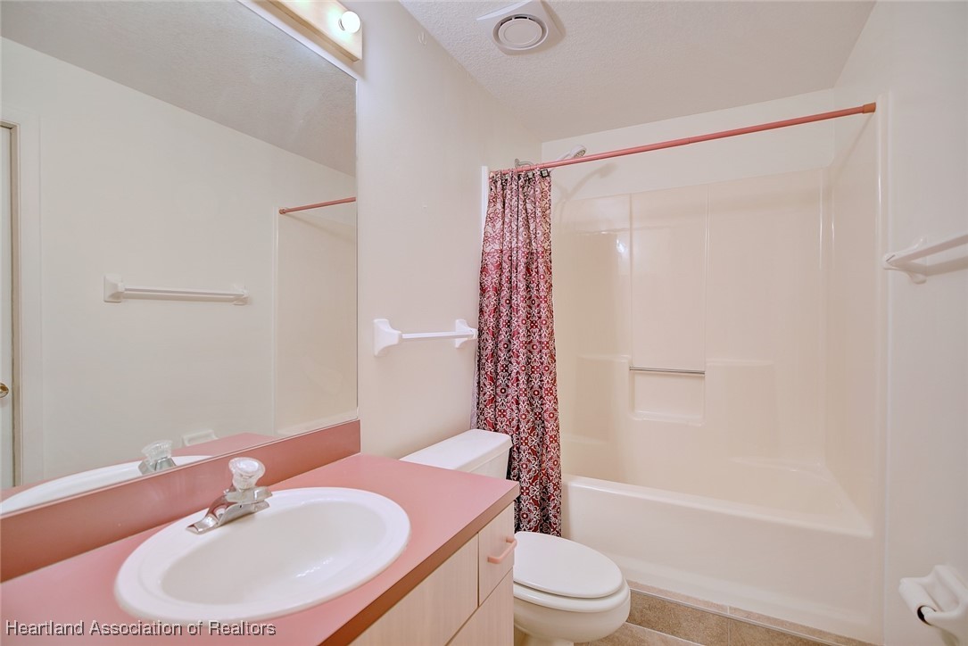 1815 Key Lake Drive Sebring, FL 33875 - Photo 27 of 41 a bathroom with a sink toilet and shower
