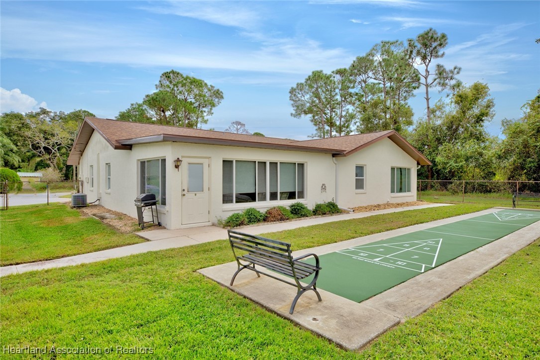 1815 Key Lake Drive Sebring, FL 33875 - Photo 31 of 41 a swimming pool with outdoor seating and yard