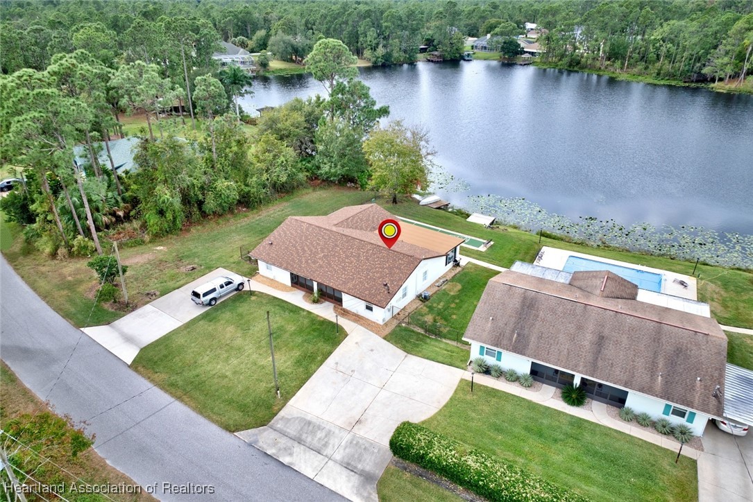 1815 Key Lake Drive Sebring, FL 33875 - Photo 35 of 41 an aerial view of a house with a yard and lake view