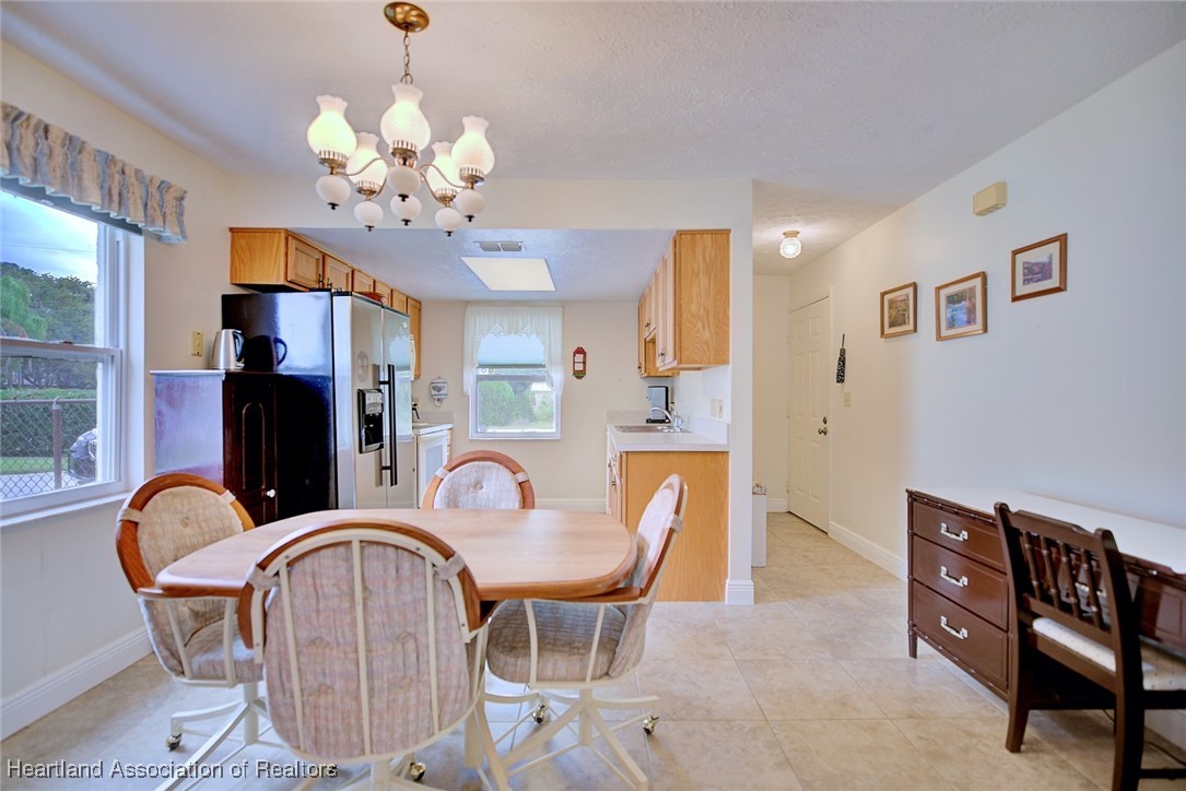 1815 Key Lake Drive Sebring, FL 33875 - Photo 4 of 41 a dining room with furniture and chandelier