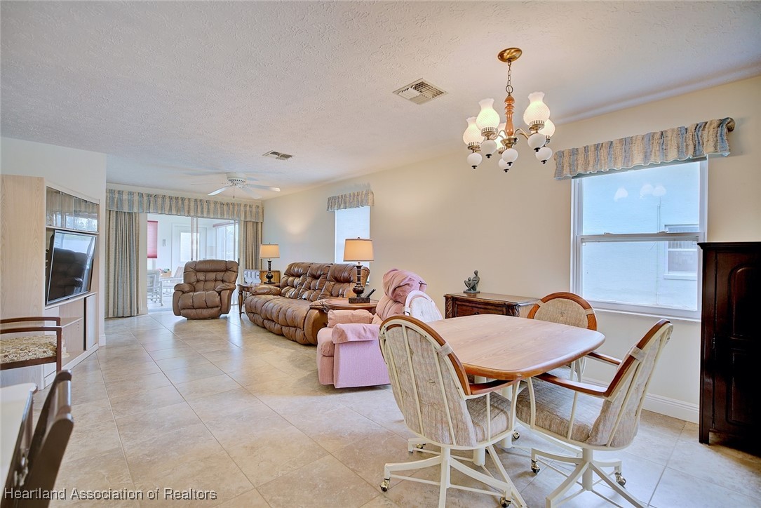 1815 Key Lake Drive Sebring, FL 33875 - Photo 5 of 41 a view of a livingroom with furniture and a chandelier