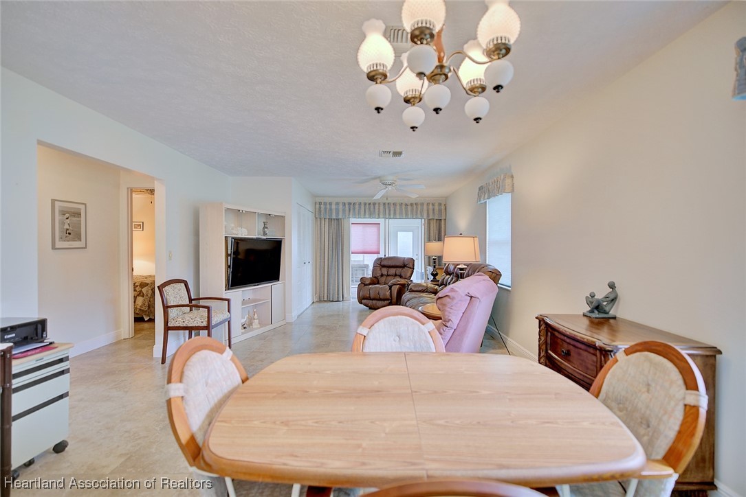 1815 Key Lake Drive Sebring, FL 33875 - Photo 6 of 41 a living room with furniture chandelier and a mirror