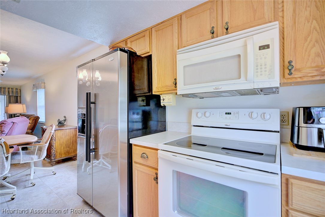 1815 Key Lake Drive Sebring, FL 33875 - Photo 10 of 41 a view of kitchen and hall with wooden floor