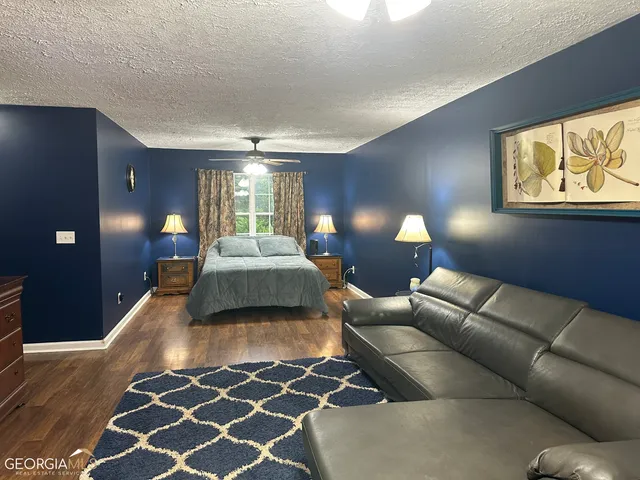 a bed room with a bed and furniture