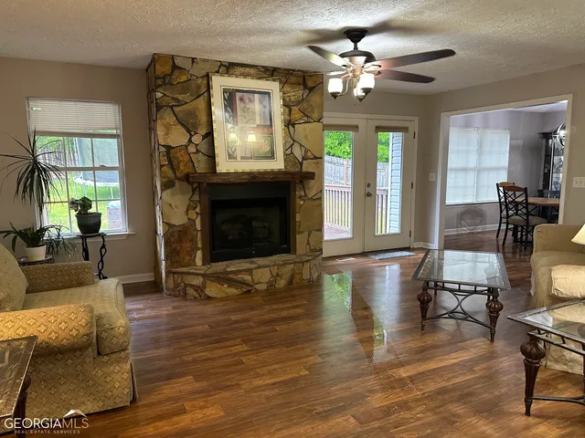 a living room with fireplace furniture and a fireplace