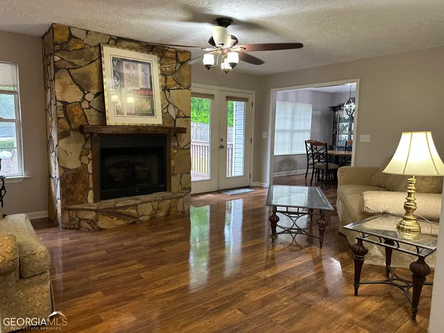 a living room with furniture and a fireplace