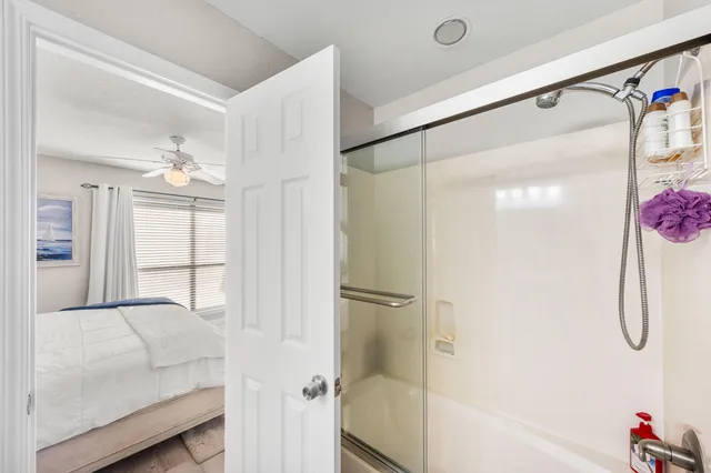 a bathroom with a tub and shower