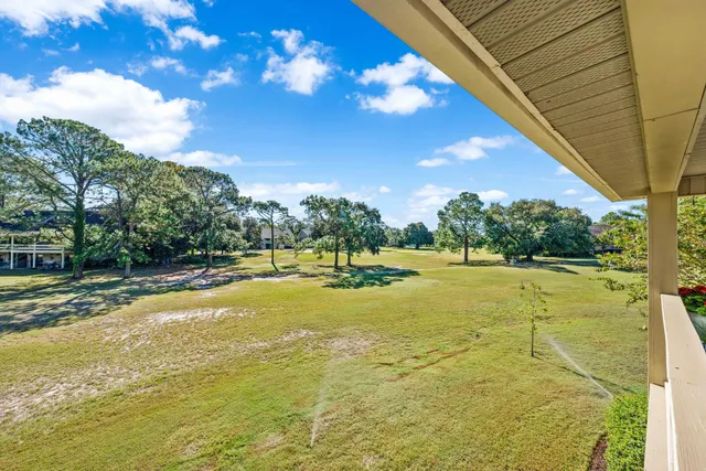 a view of a swimming pool with an outdoor space and seating area