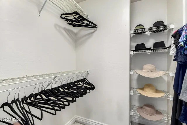 a bathroom with a toilet a sink and a mirror