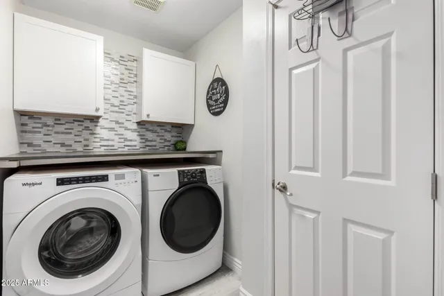 a utility room with dryer and washer