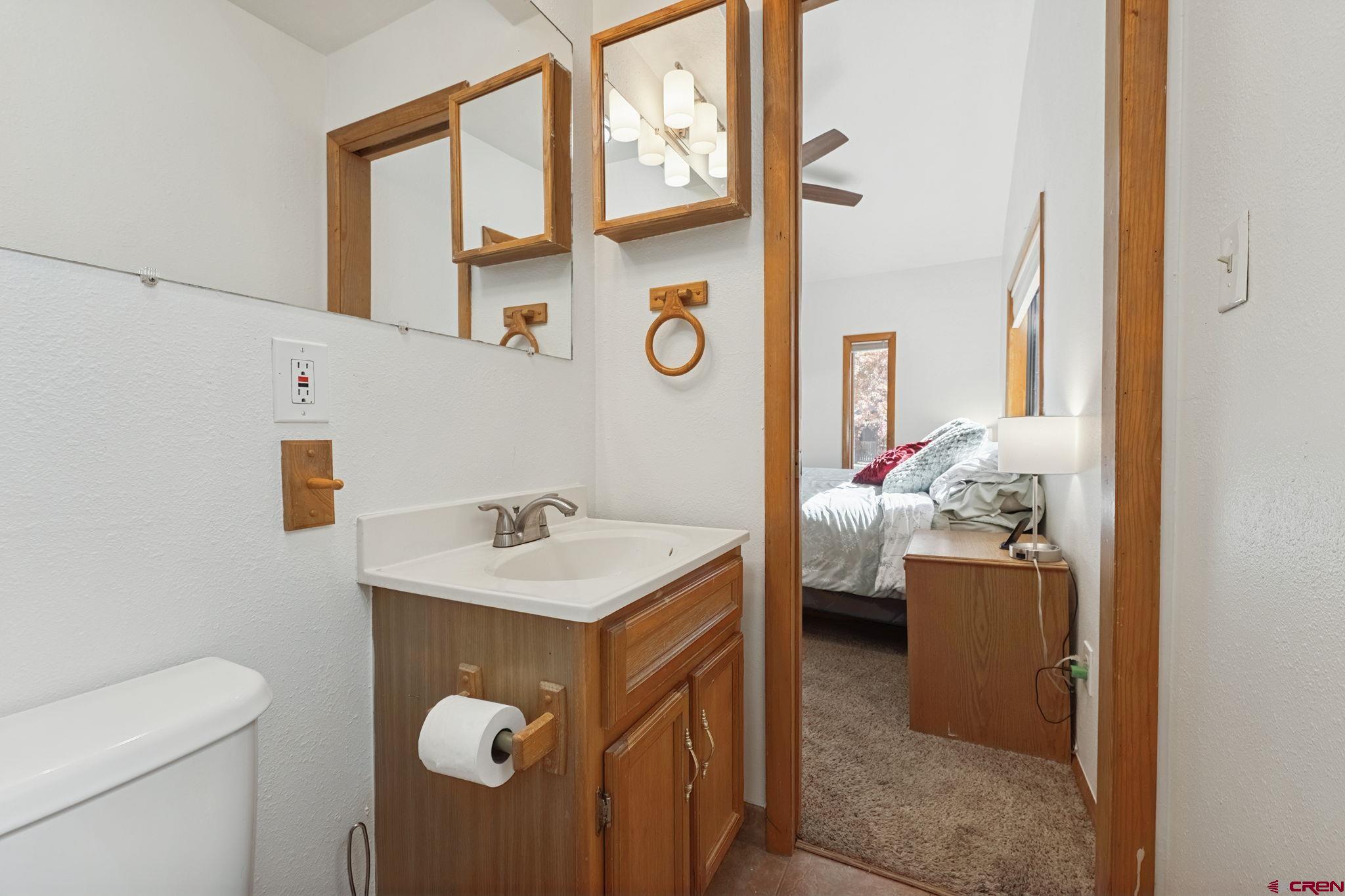 2807 Junction Street Durango, CO 81301 - Photo 11 of 26 a bathroom with a sink a toilet and a window