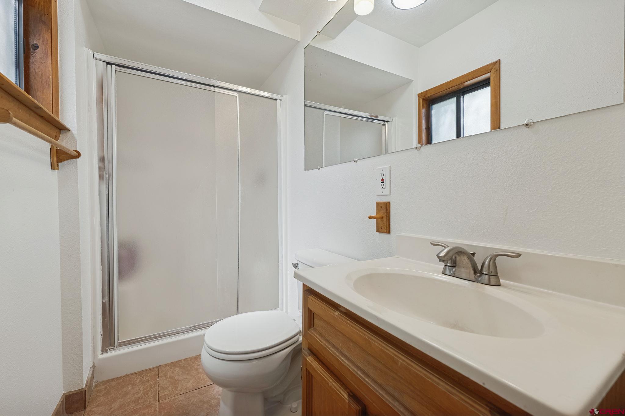2807 Junction Street Durango, CO 81301 - Photo 12 of 26 a bathroom with a sink a toilet and shower