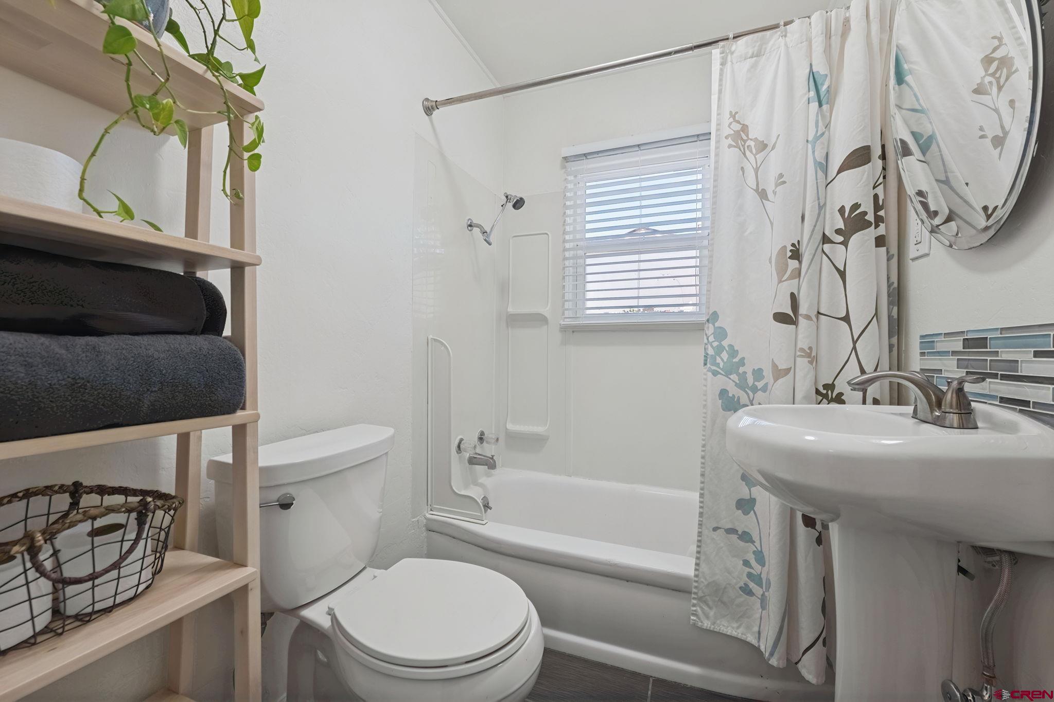 2807 Junction Street Durango, CO 81301 - Photo 14 of 26 a bathroom with a sink a toilet and shower