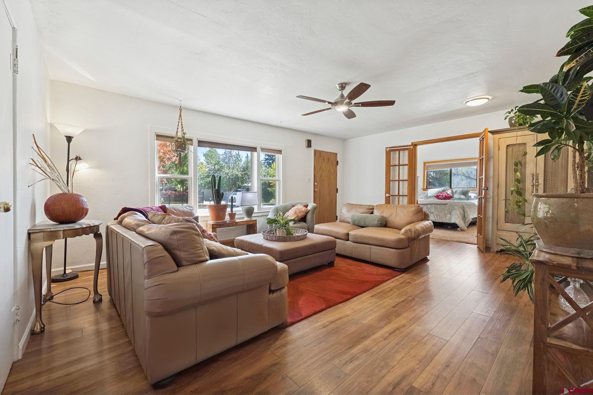 2807 Junction Street Durango, CO 81301 - Photo 2 of 26 a living room with furniture a ceiling fan and a large window