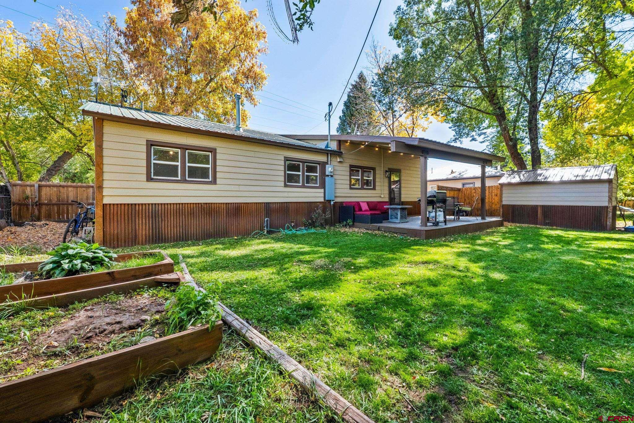 2807 Junction Street Durango, CO 81301 - Photo 22 of 26 a view of a house with backyard and sitting area