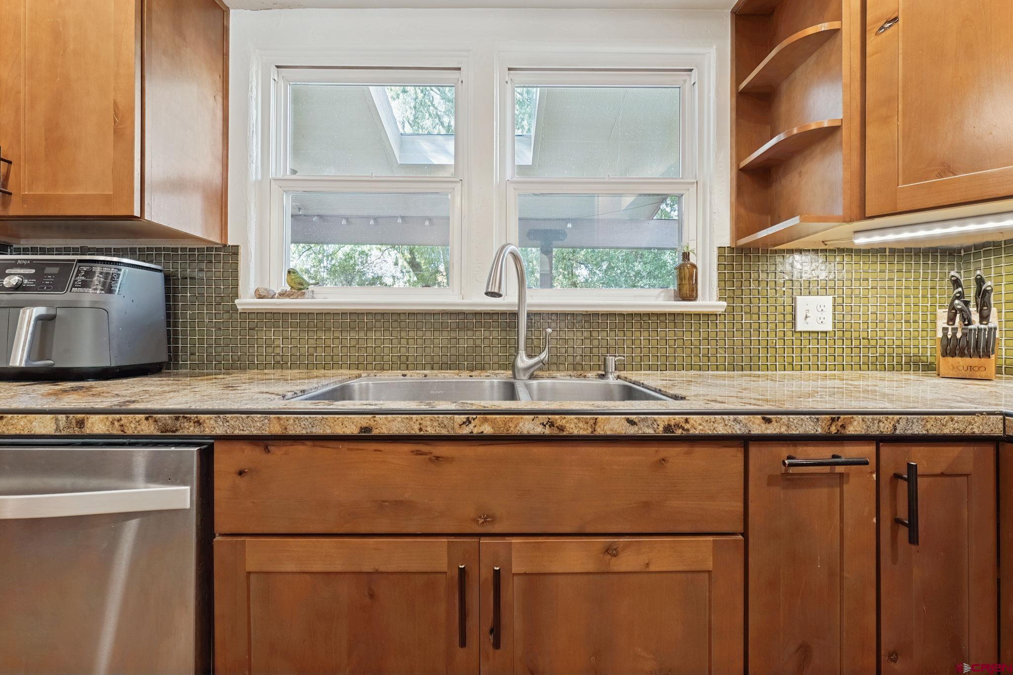 2807 Junction Street Durango, CO 81301 - Photo 7 of 26 a kitchen with granite countertop a sink and a window