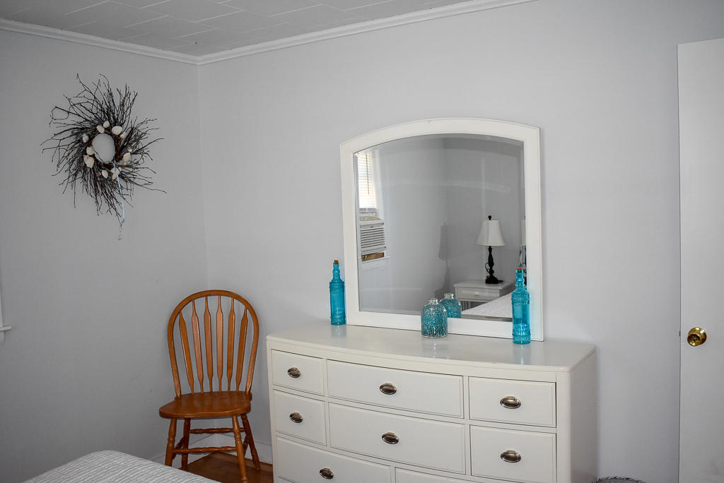 101 Lower County Road, Unit 7B Dennis Port, MA 02639 - Photo 13 of 17 a living room with furniture and a potted plant