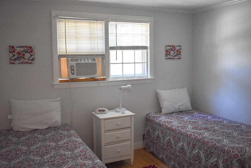 101 Lower County Road, Unit 7B Dennis Port, MA 02639 - Photo 9 of 17 a bedroom with a bed and a window