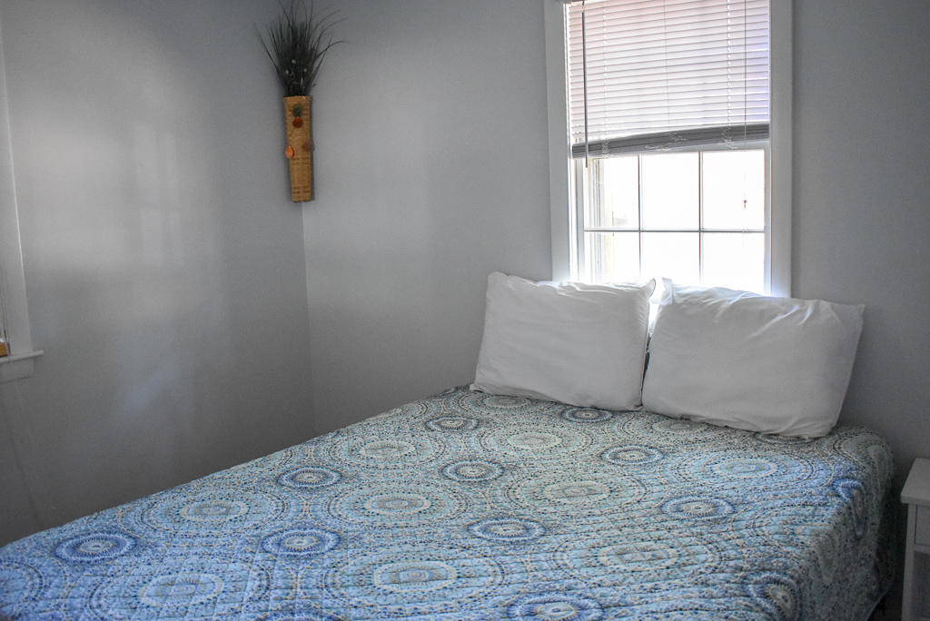 101 Lower County Road, Unit 7B Dennis Port, MA 02639 - Photo 10 of 17 a room with a bed and a window