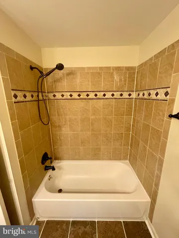 a bathroom with a bath tub