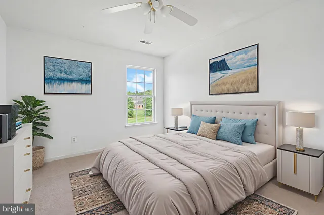 a bedroom with bed and a window