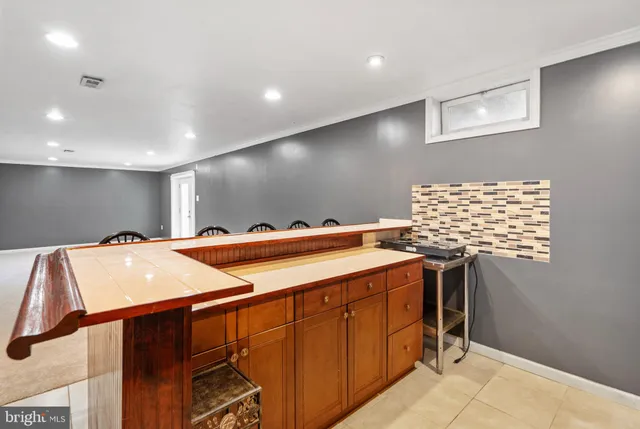 a spacious bathroom with a sink and a mirror
