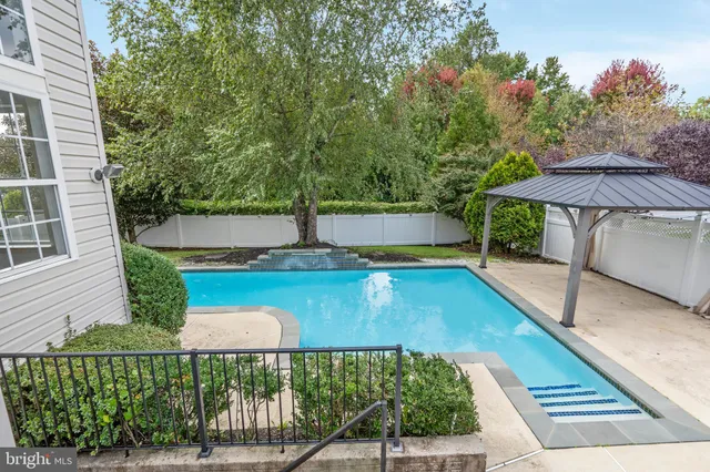 a view of a balcony with yard