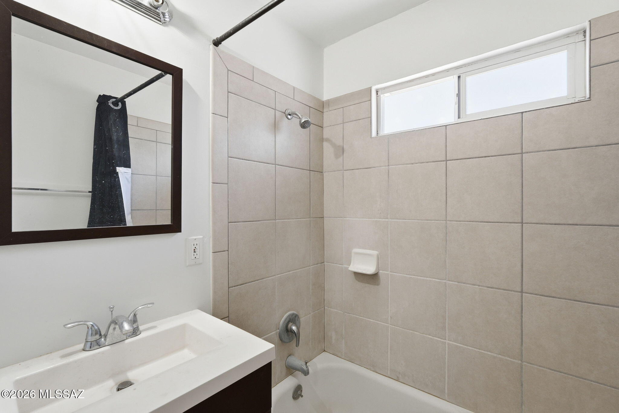 2721 East Fort Lowell Road Tucson, AZ 85716 - Photo 14 of 28 a bathroom with a sink shower and a mirror