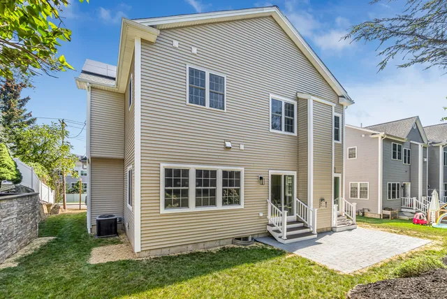 a view of house with backyard