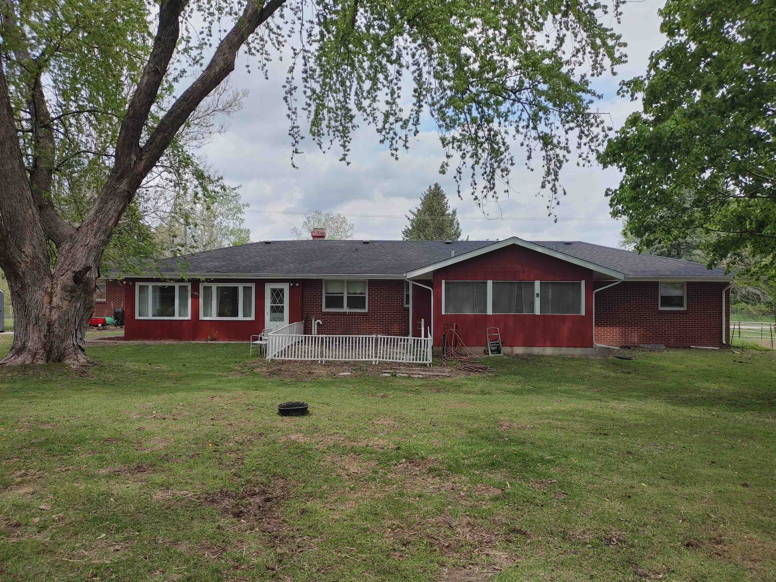 5515 Rotary Road Cherry Valley, IL 61016 - Photo 11 of 31 a front view of a house with garden