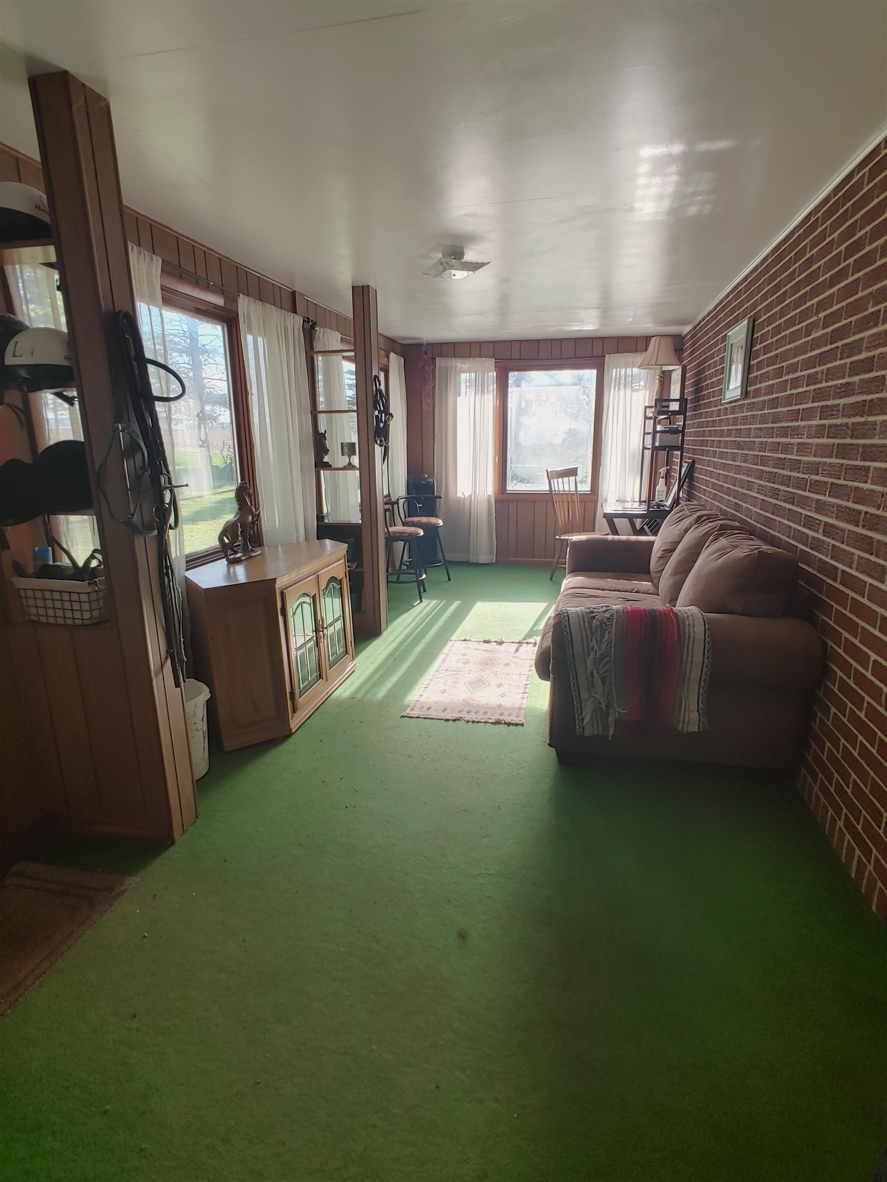 5515 Rotary Road Cherry Valley, IL 61016 - Photo 24 of 31 a living room with furniture and a flat screen tv