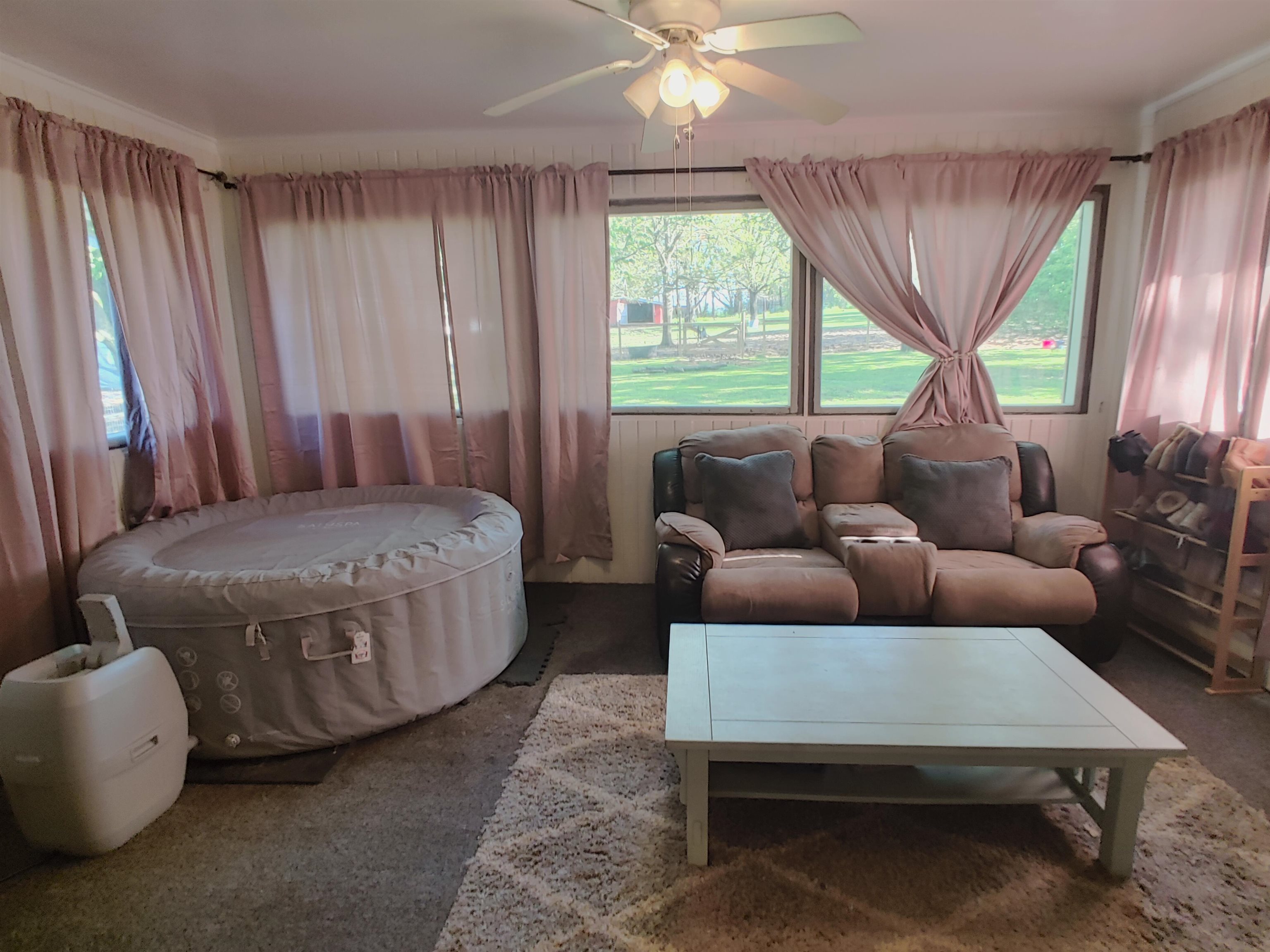 5515 Rotary Road Cherry Valley, IL 61016 - Photo 26 of 31 a living room with furniture and a large window