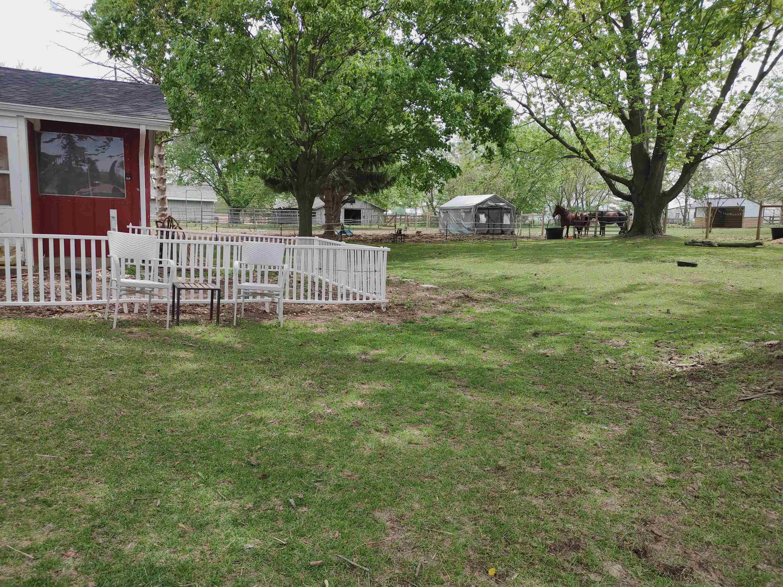 5515 Rotary Road Cherry Valley, IL 61016 - Photo 9 of 31 a view of a house with a yard and a bench