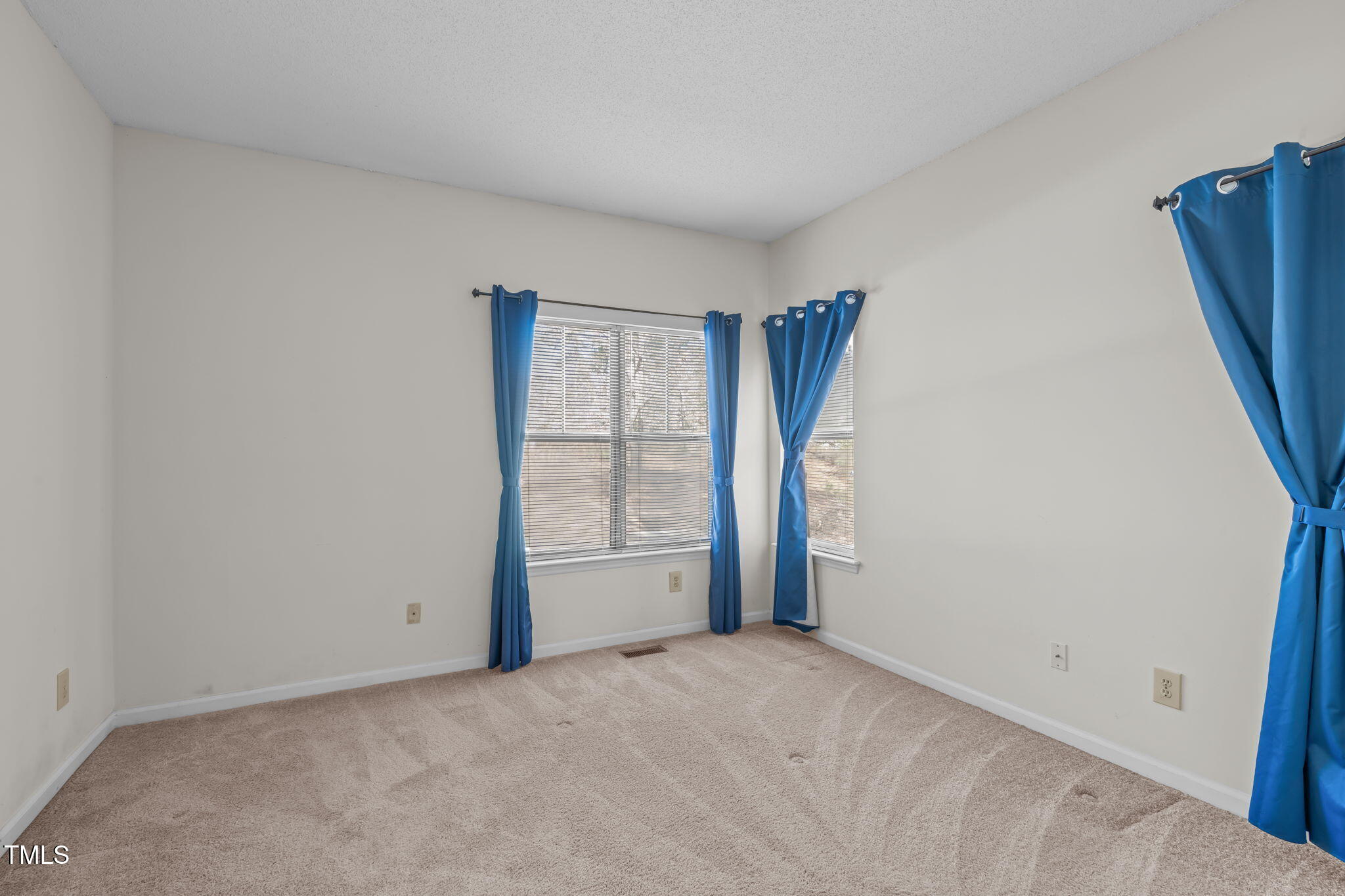 6131 Summer Pointe Place, Unit 101 Raleigh, NC 27606 - Photo 11 of 21 a view of an empty room with a window