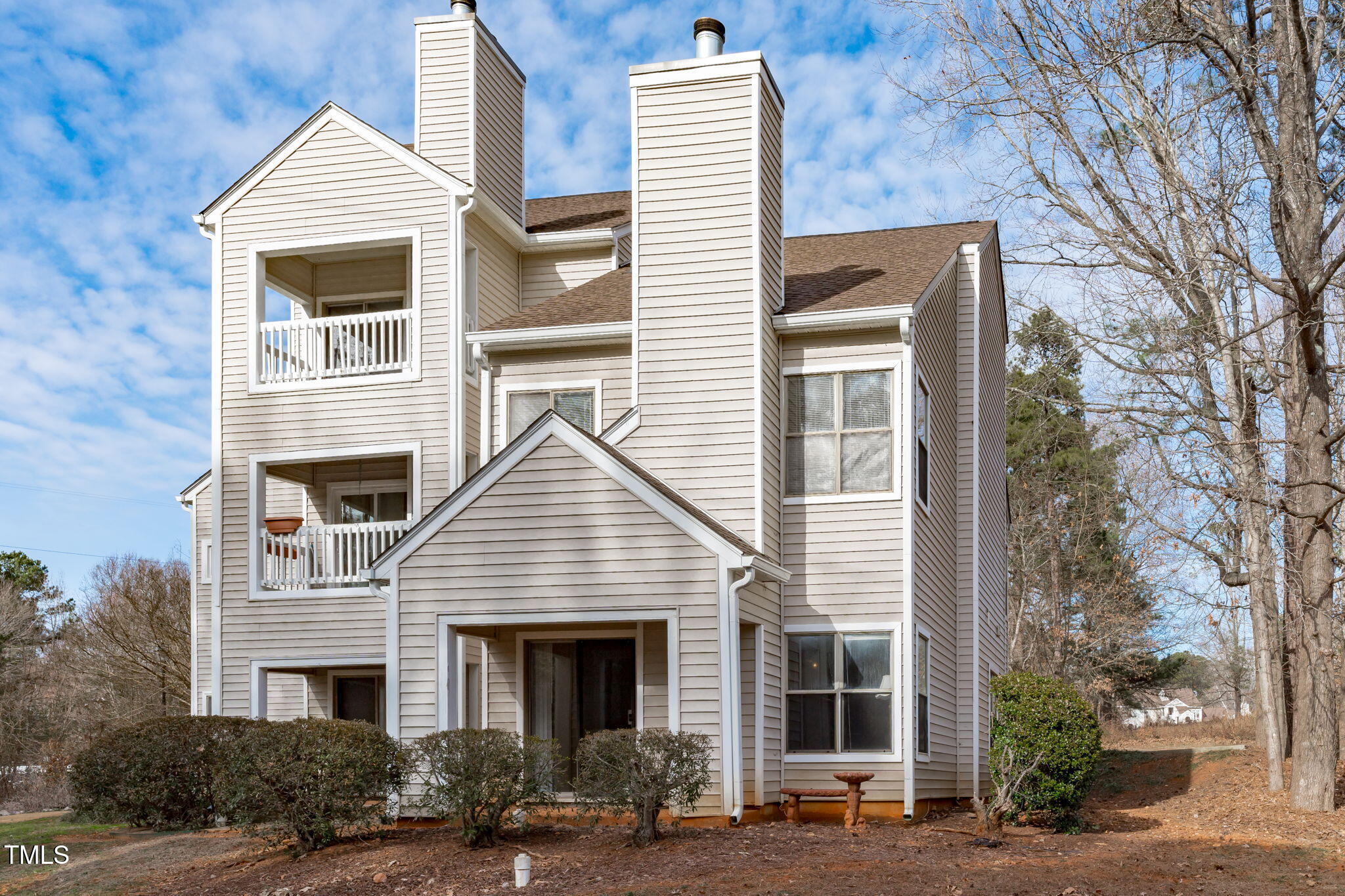 6131 Summer Pointe Place, Unit 101 Raleigh, NC 27606 - Photo 18 of 21 a front view of a house with garage