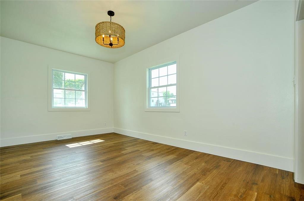 113 3rd Street Houston, PA 15342 - Photo 14 of 27 an empty room with wooden floor and windows