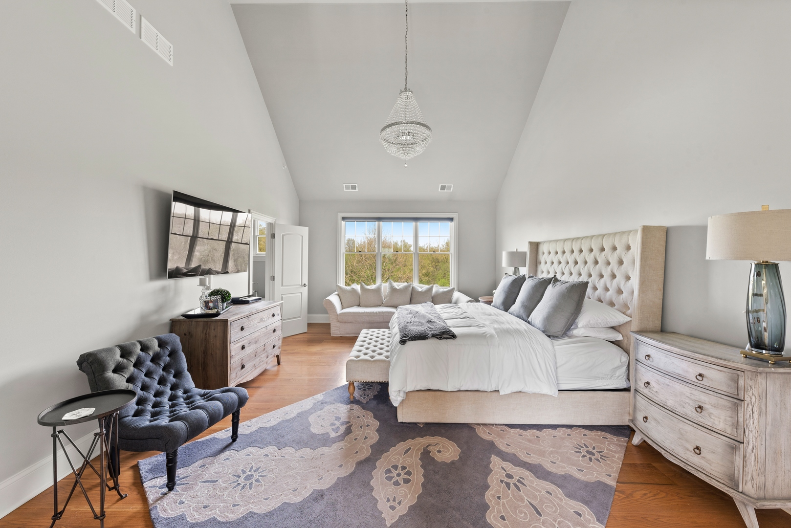 26070 West Sunset Road Barrington, IL 60010 - Photo 11 of 30 a spacious bedroom with a bed a couch and dresser