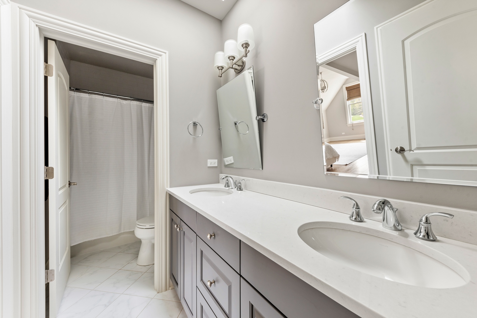26070 West Sunset Road Barrington, IL 60010 - Photo 17 of 30 a bathroom with a sink and a mirror