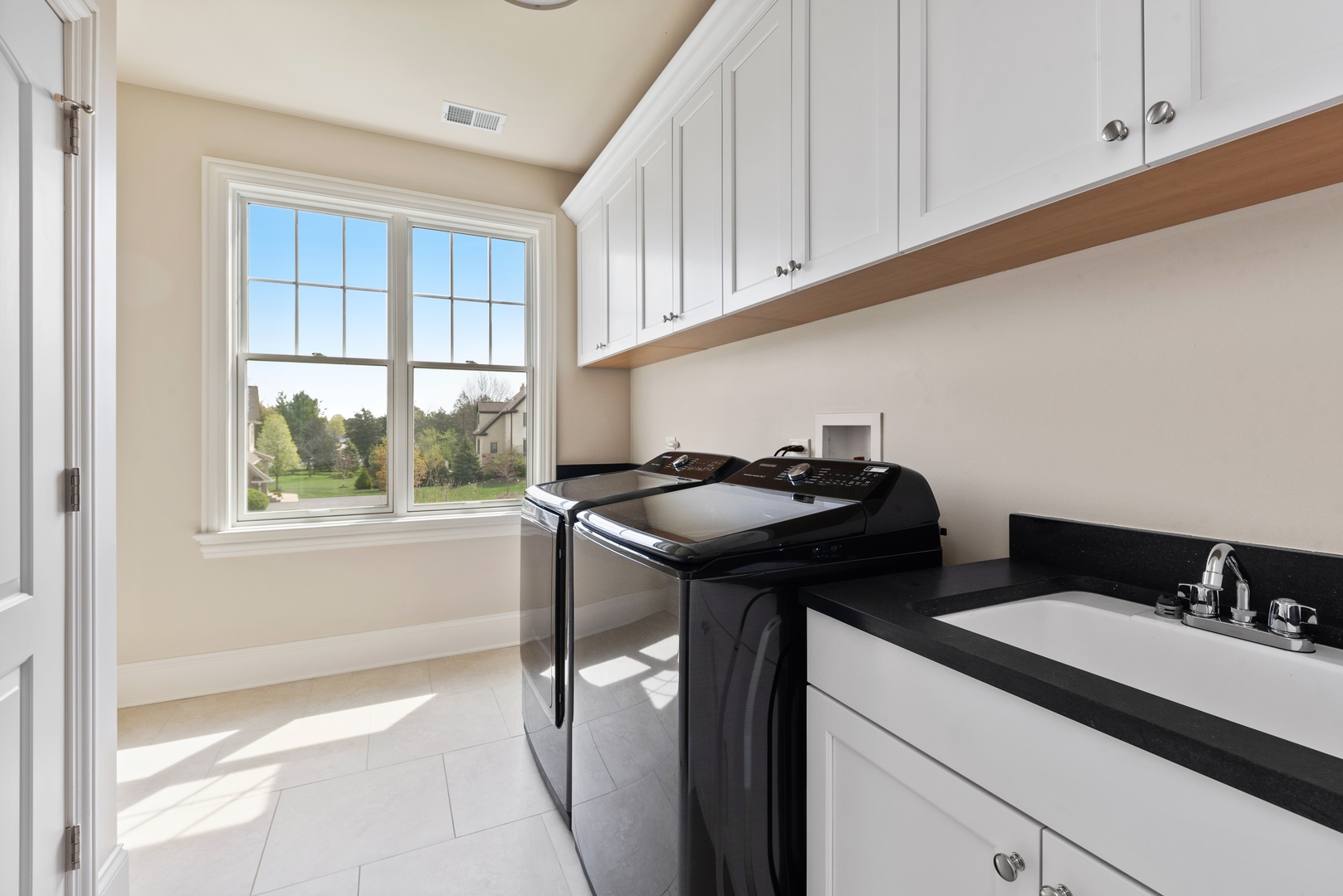 26070 West Sunset Road Barrington, IL 60010 - Photo 25 of 30 a bathroom with a sink and a window