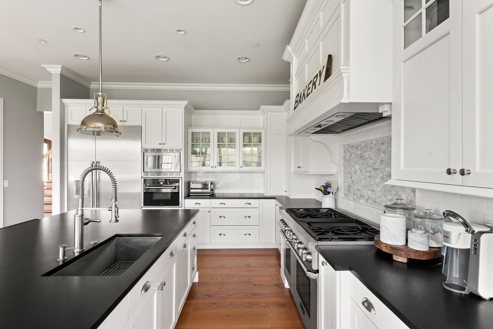 26070 West Sunset Road Barrington, IL 60010 - Photo 7 of 30 a kitchen with stainless steel appliances granite countertop a sink stove and refrigerator