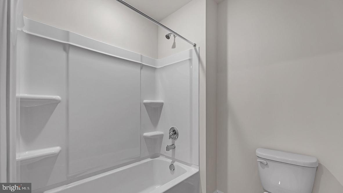155 Littleworth Road Manahawkin, NJ 08050 - Photo 32 of 32 a bathroom with a bathtub a toilet and a shower